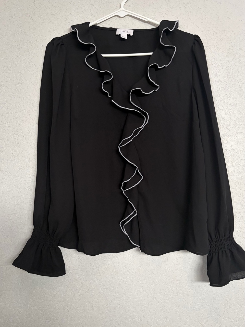 CeCe Black Ruffle-Trim Blouse with White Piping
